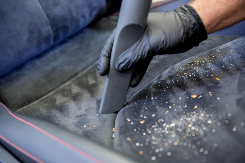Vacuuming a car seat